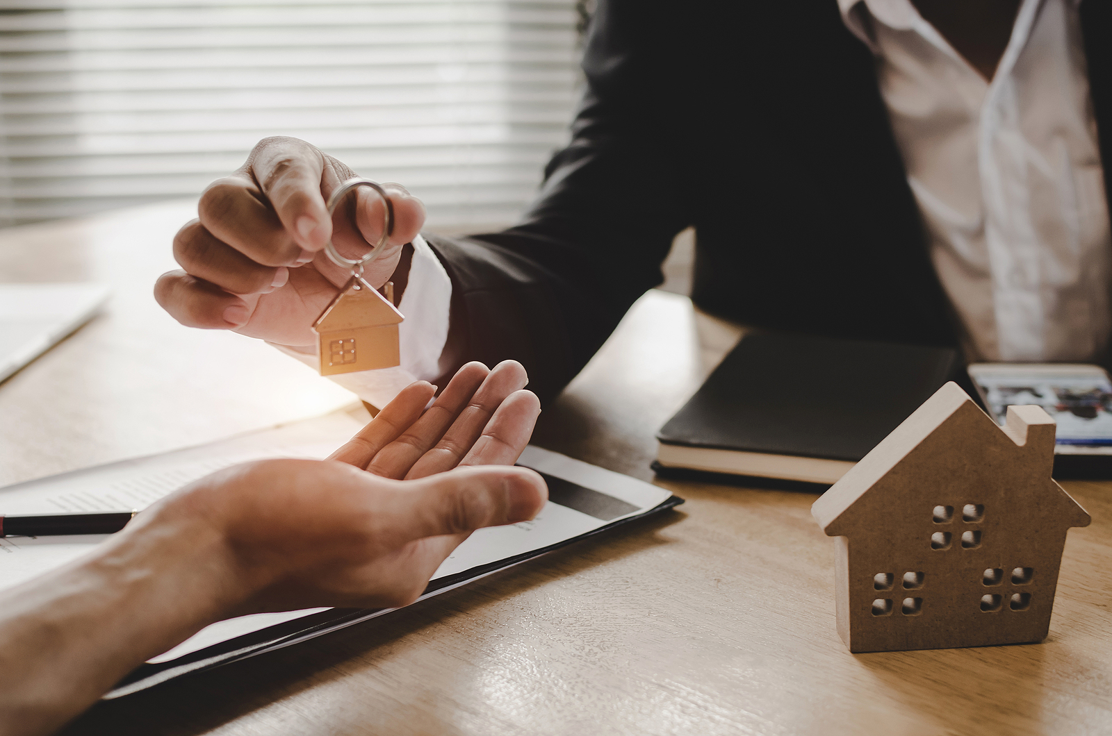 Real Estate Broker Manager Giving House Key To Customer After Si lettings agent management